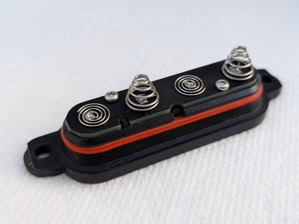 A high-quality close-up of a GeoDrops battery cap after one year of use after cleaning, free of debris