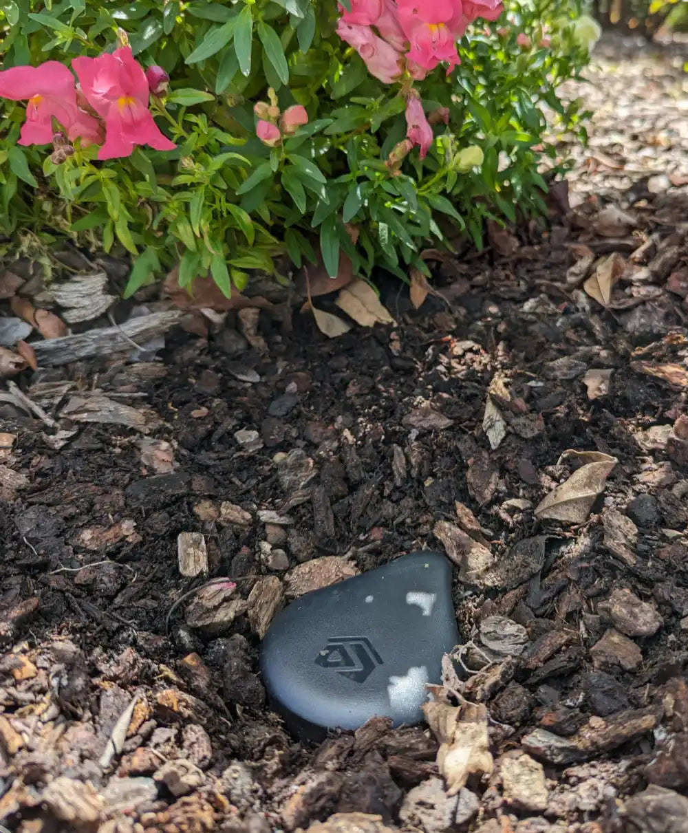 Image showing GeoDrops Droplet installed in a raised flower bed.